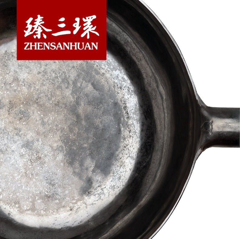https://www.zhangqiuwok.com/cdn/shop/products/ZhangQiu-ZhenSanHuan-Chinese-hand-hammered-carbon-steel-iron-handle-wok-zongshi-4_1946x.jpg?v=1675747252
